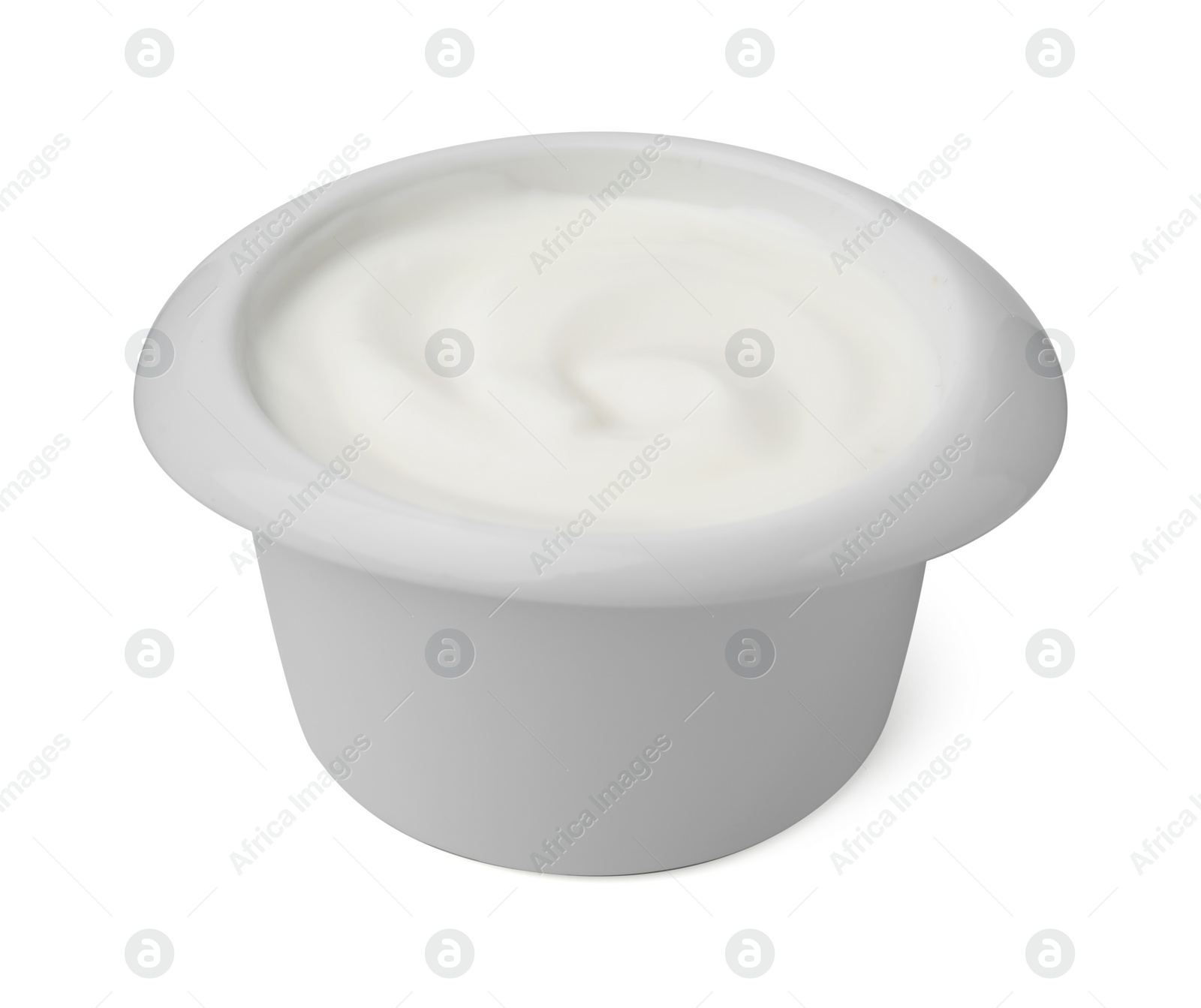 Photo of Delicious natural yogurt in bowl isolated on white