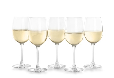 Glasses with white wine on light background
