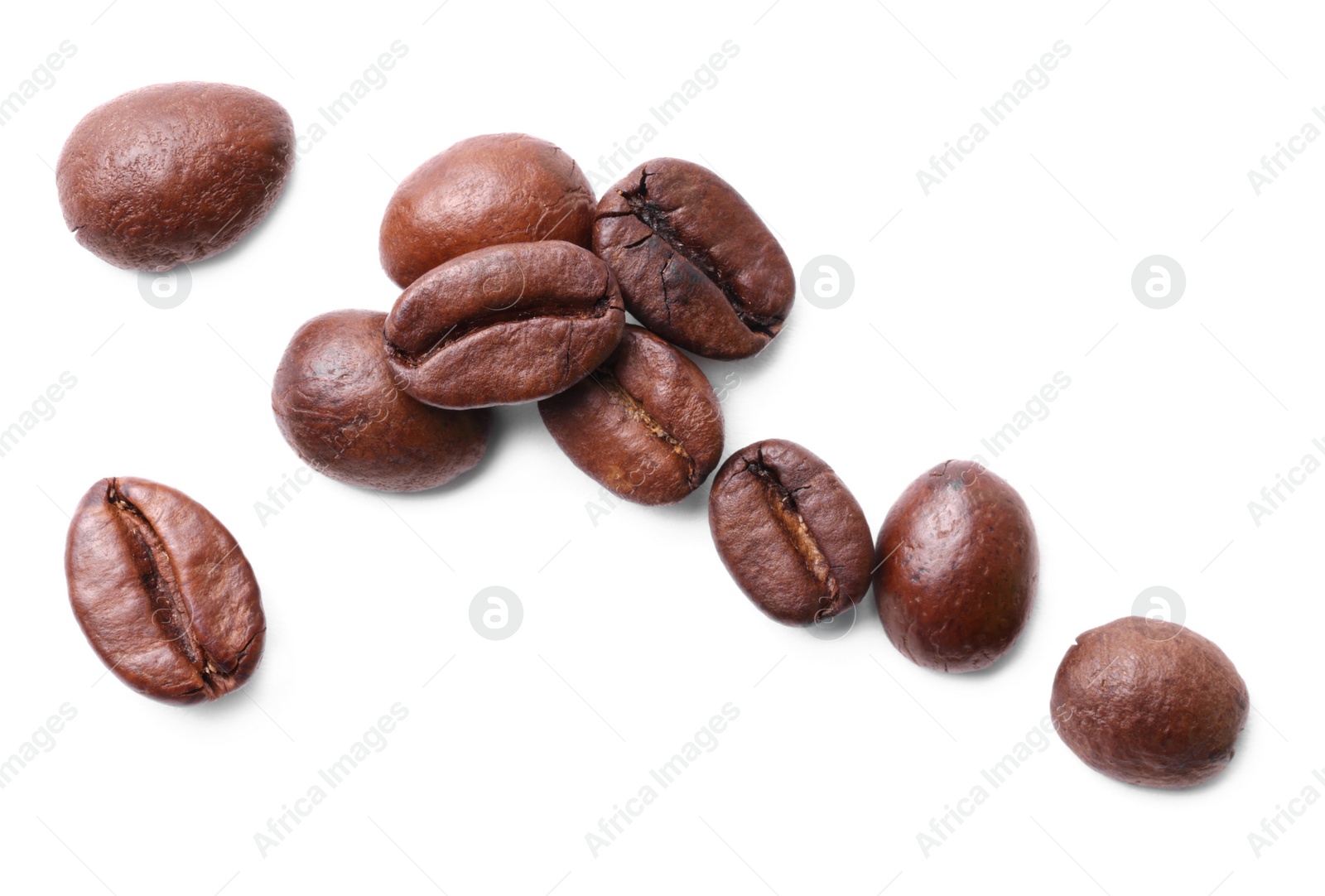 Photo of Many roasted coffee beans isolated on white, top view