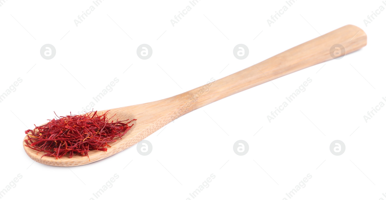 Photo of Wooden spoon with dried saffron isolated on white