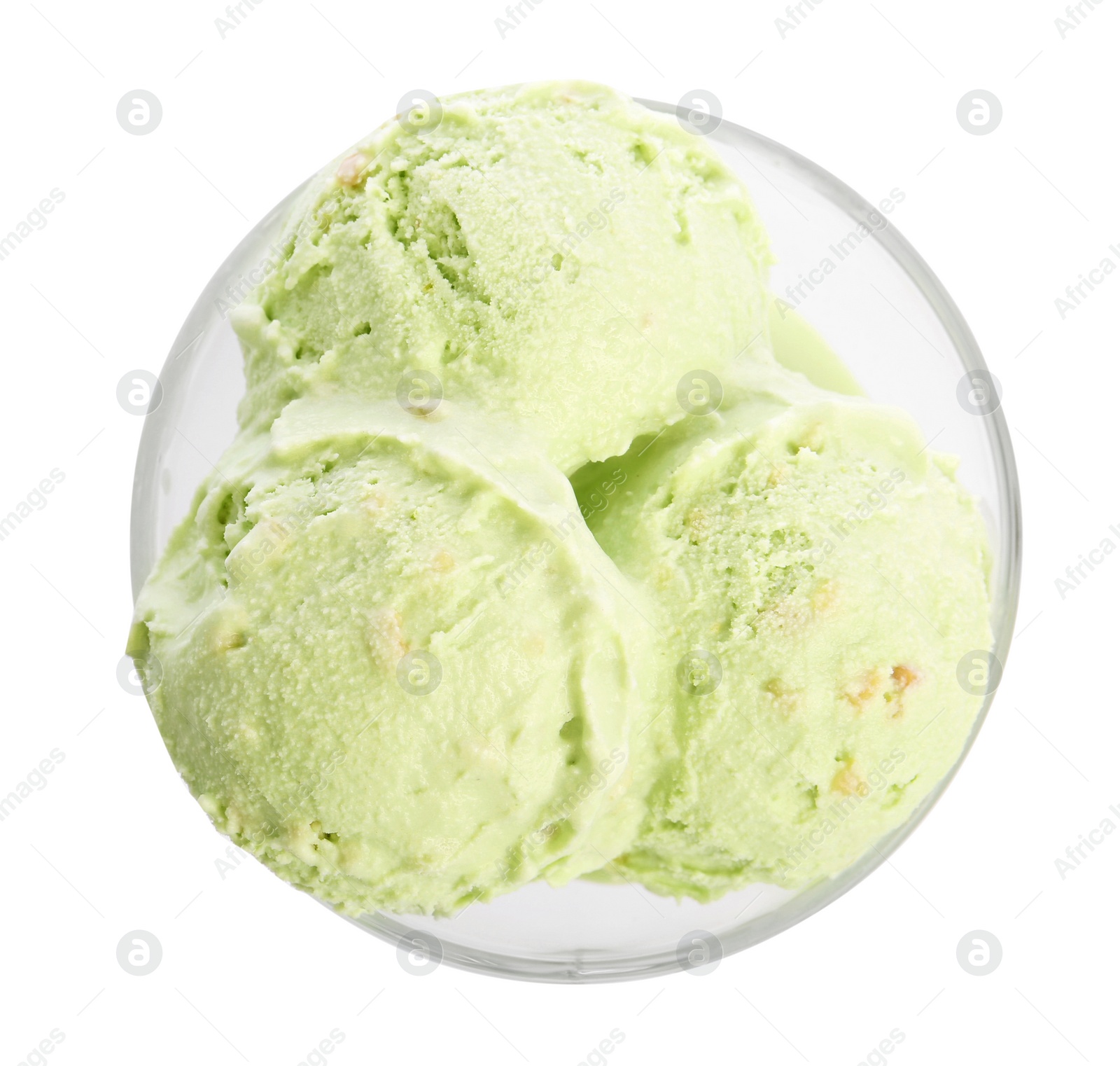 Photo of Dishware of sweet pistachio ice cream on white background, top view