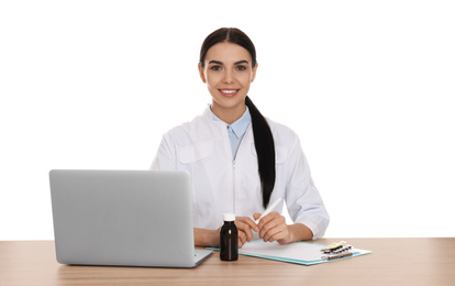 Photo of Professional pharmacist working at table against white background