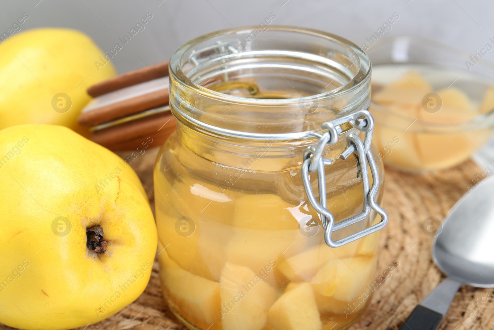Photo of Delicious quince drink and fresh fruits on table, closeup