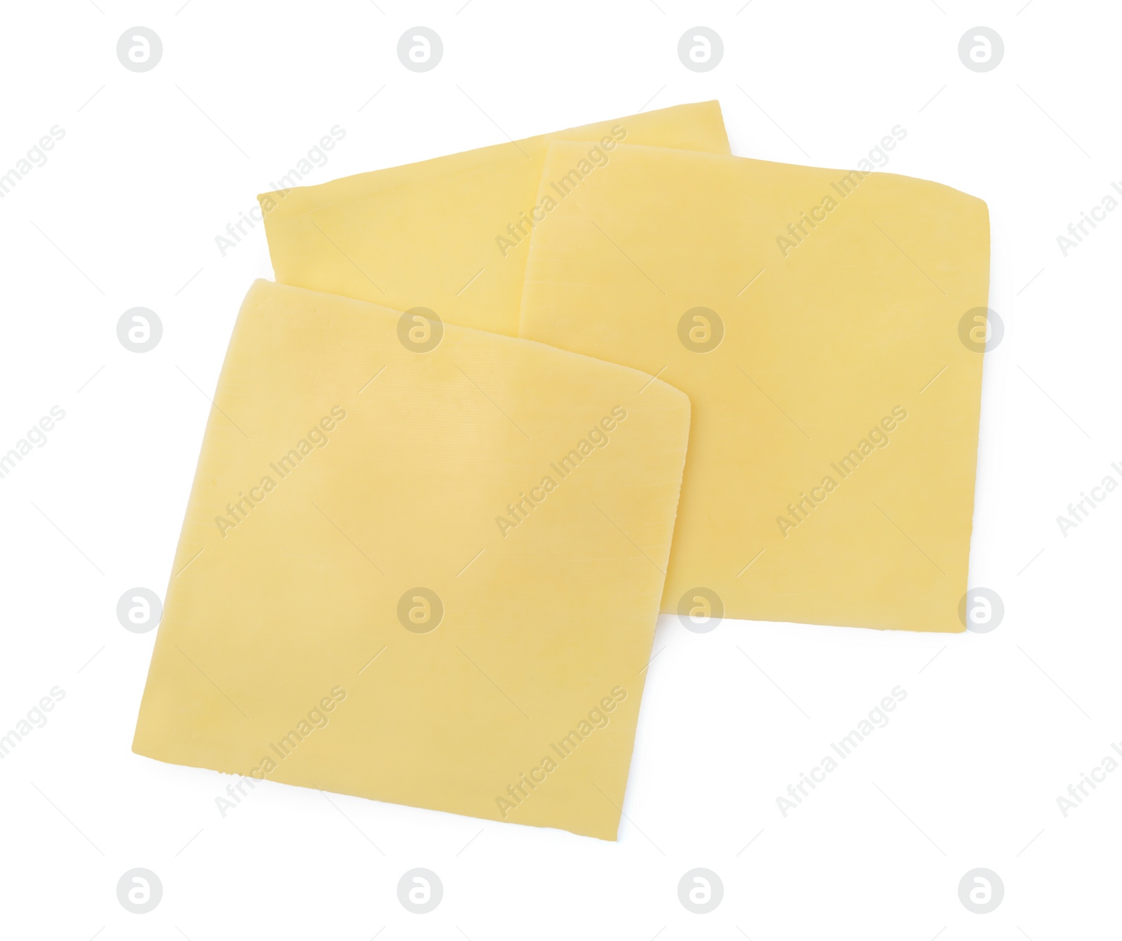 Photo of Slices of tasty fresh cheese isolated on white, top view