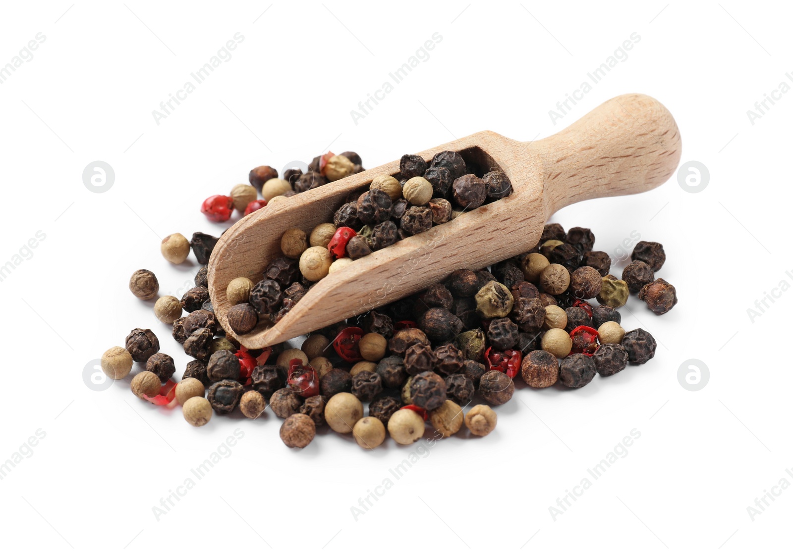 Photo of Aromatic spices. Different peppers and wooden scoop isolated on white