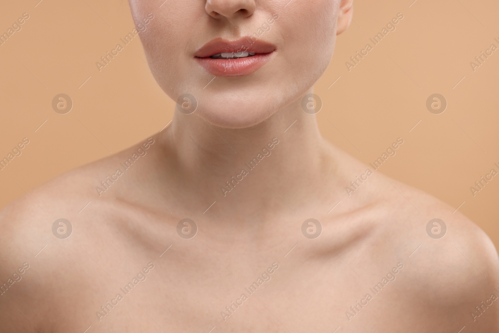 Photo of Beauty concept. Woman on beige background, closeup