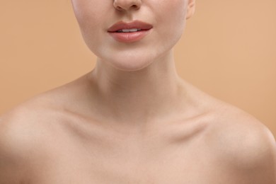 Photo of Beauty concept. Woman on beige background, closeup