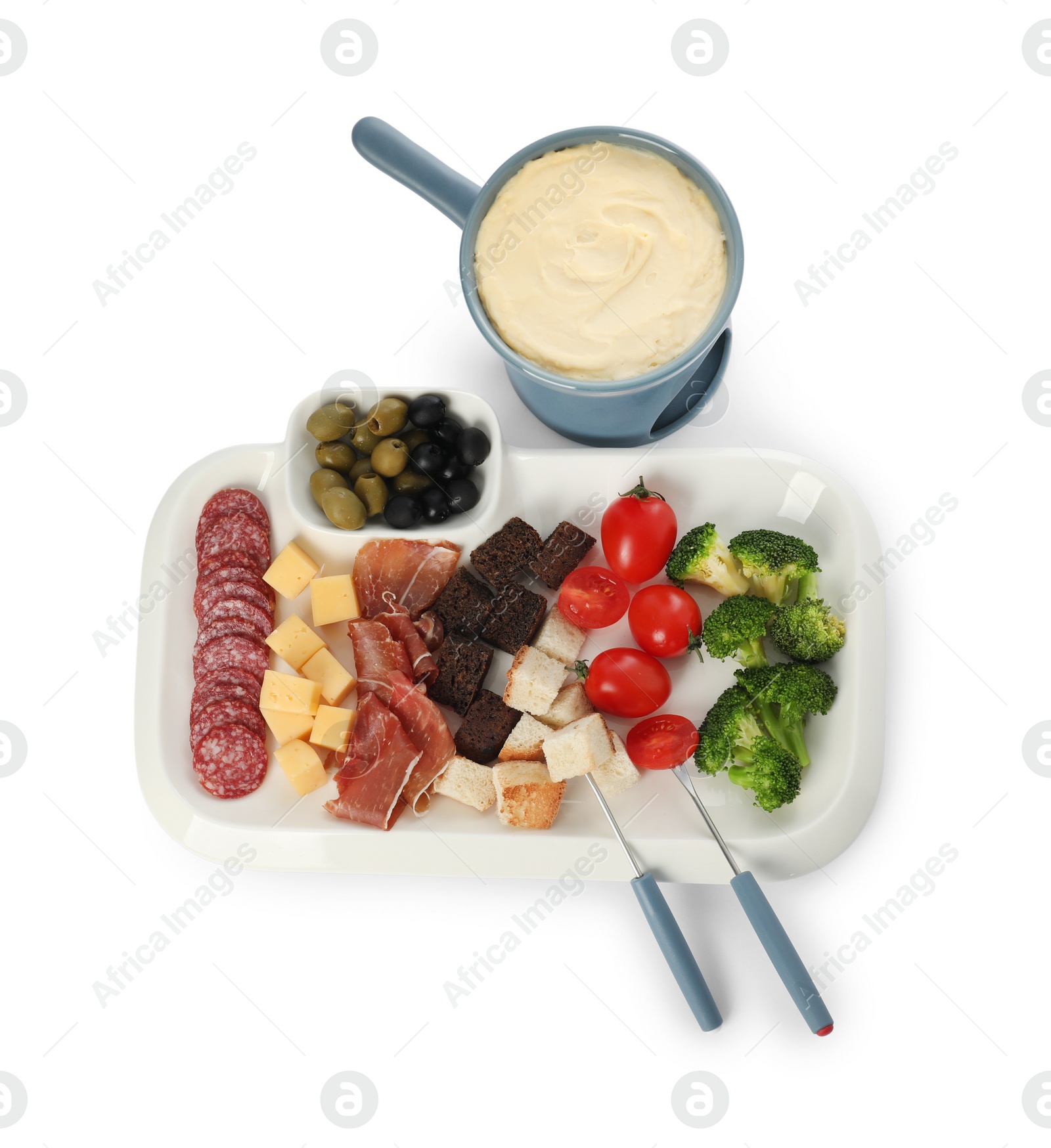 Photo of Fondue with tasty melted cheese, forks and different snacks isolated on white, top view