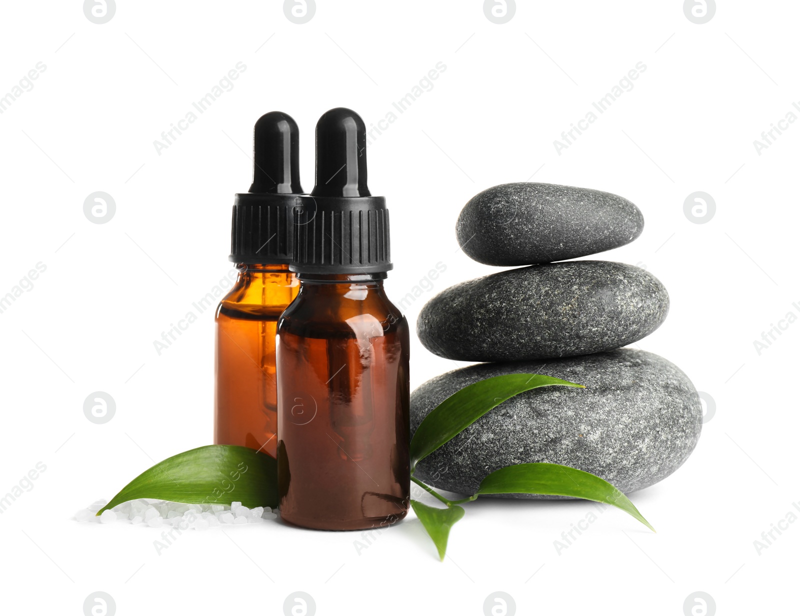 Photo of Composition with aroma oil and spa stones on white background