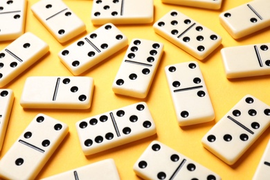 Set of classic domino tiles on yellow background