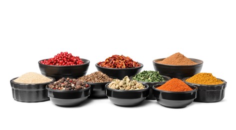 Bowls with different spices on white background