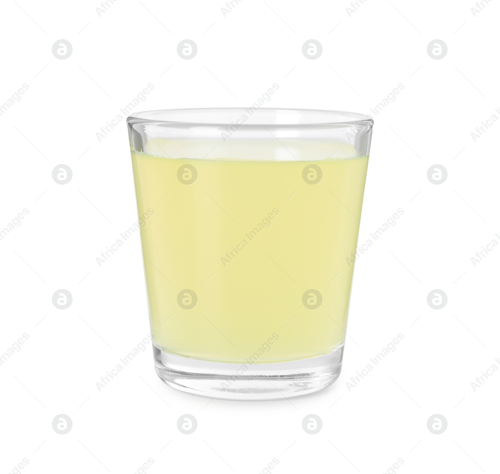 Photo of Shot glass with tasty limoncello liqueur isolated on white