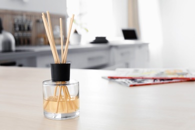 Photo of Reed freshener on table indoors