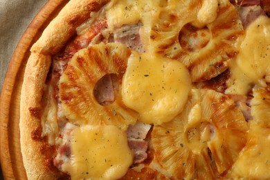 Photo of Delicious pineapple pizza on table, top view
