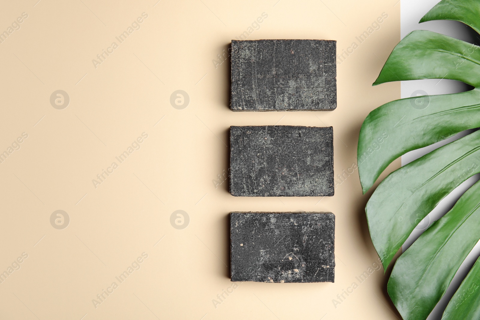 Photo of Flat lay composition with handmade soap bars on color background. Space for text