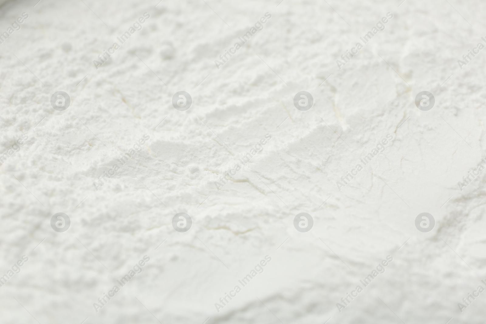 Photo of Texture of baking powder as background, closeup