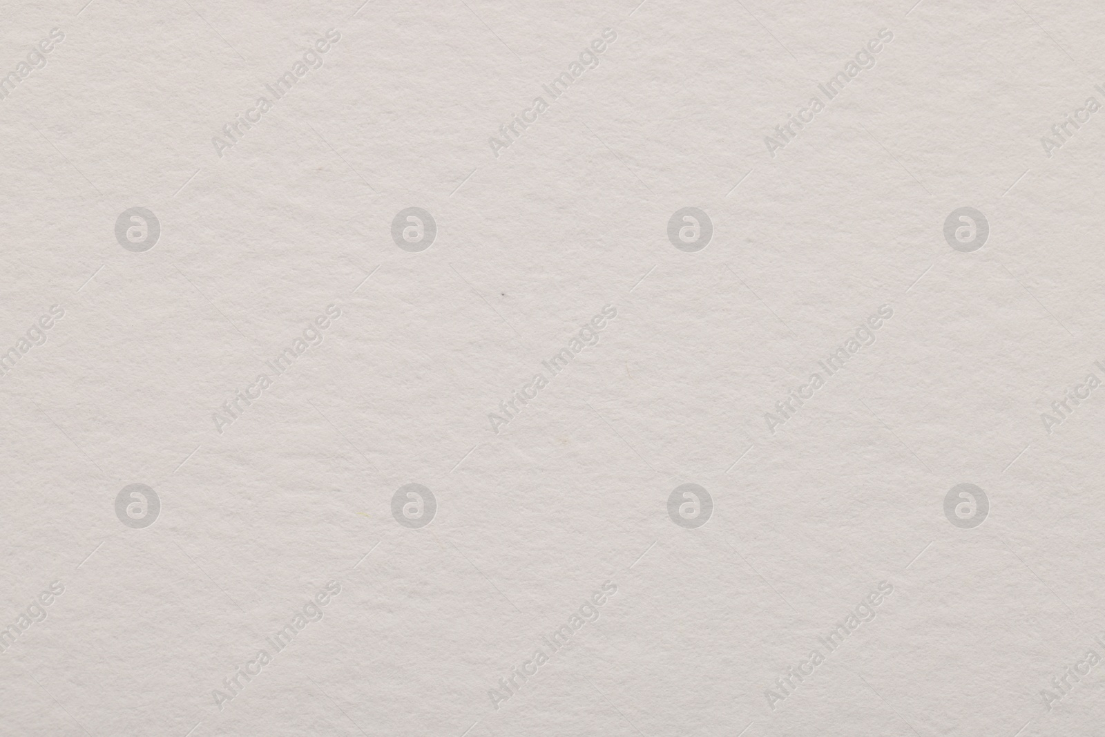 Photo of Texture of light grey paper sheet as background, top view