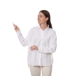Photo of Beautiful woman pointing at something with pen on white background. Weather forecast reporter