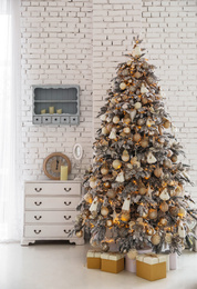 Photo of Beautiful room interior with decorated Christmas tree