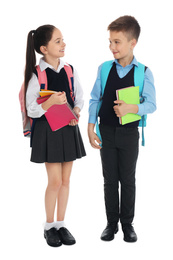 Little children with school stationery on white background