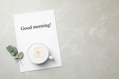 Photo of Flat lay composition with coffee on grey marble table, space for text. Tasty breakfast