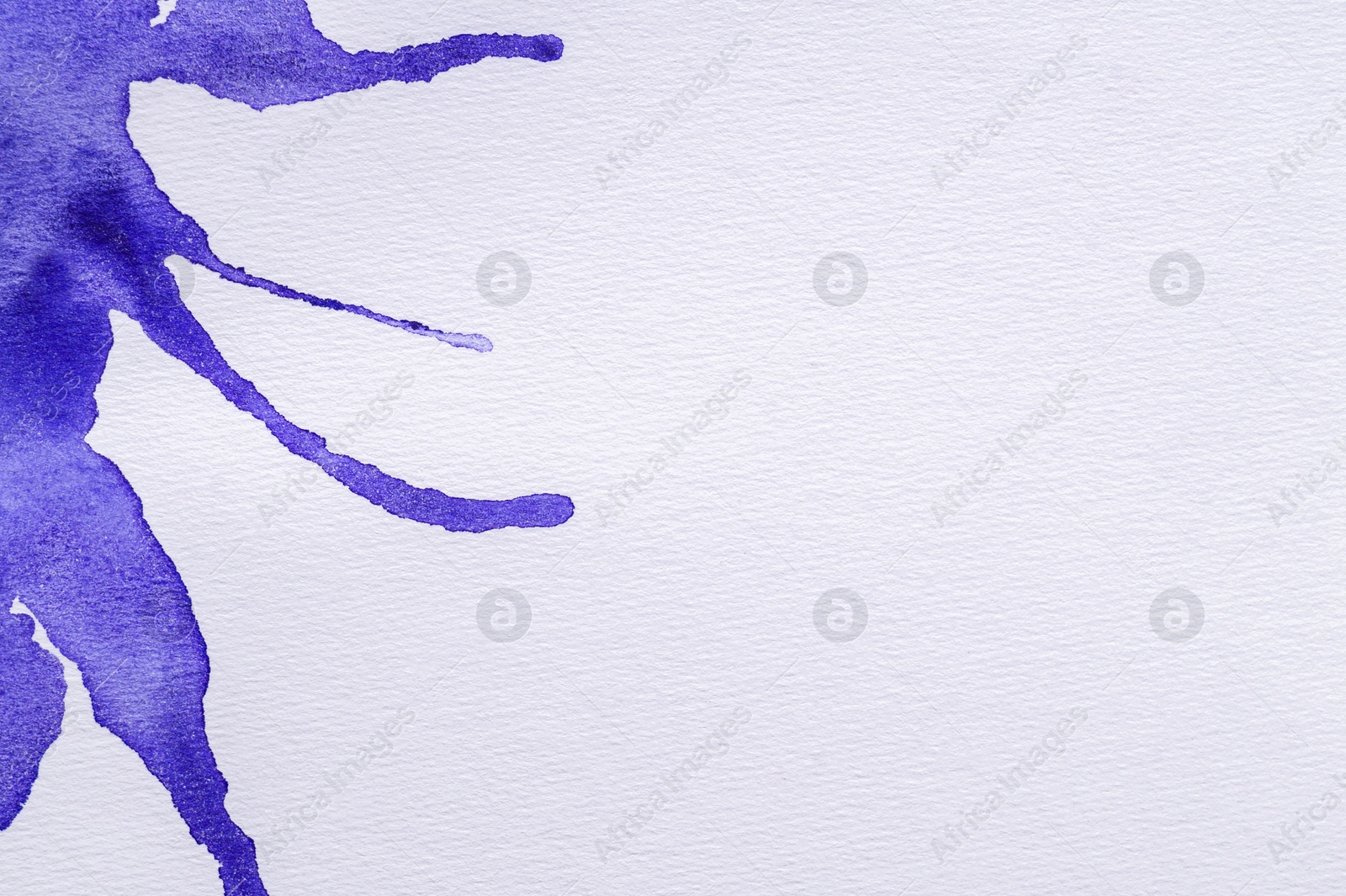 Photo of Blue watercolor blots on white background, top view. Space for text