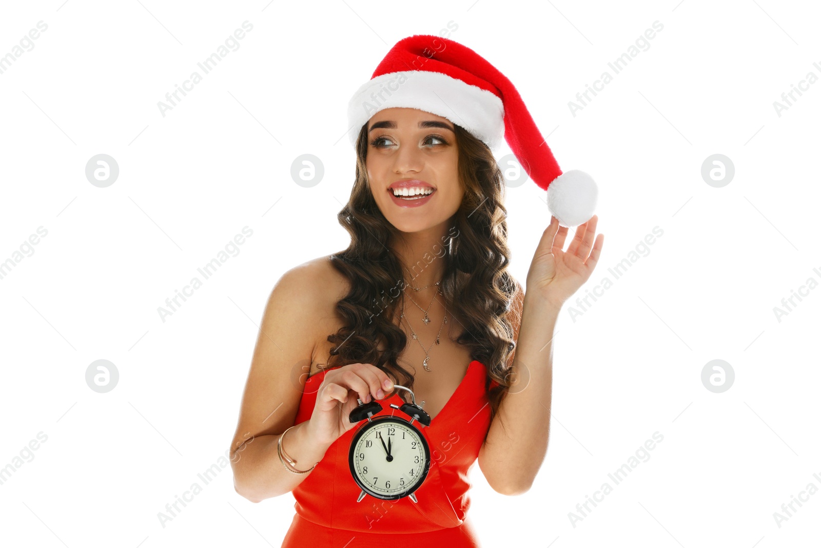 Photo of Beautiful woman in Santa hat holding alarm clock on white background. Christmas celebration