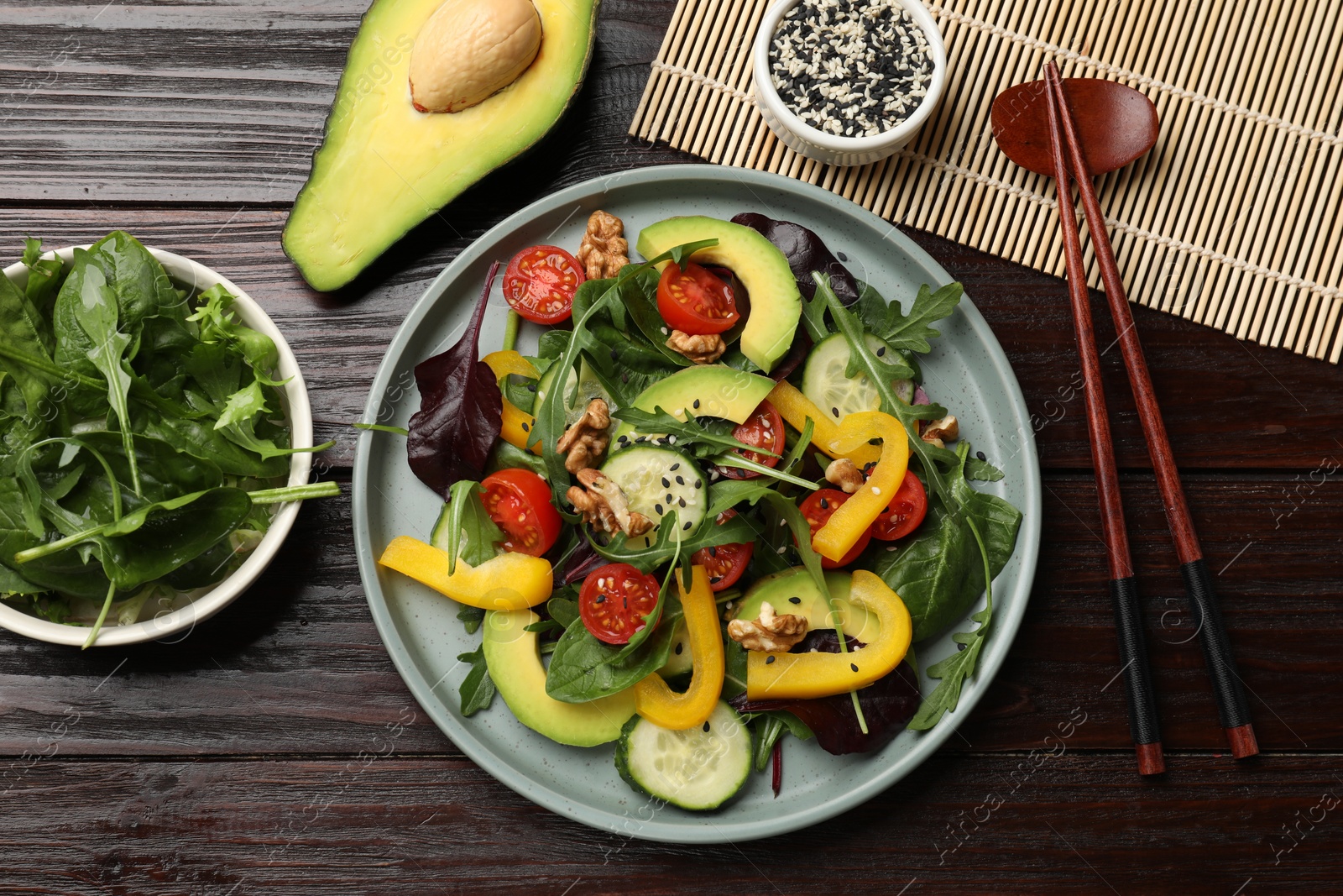 Photo of Balanced diet and vegetarian foods. Plate with different delicious products on wooden table, flat lay