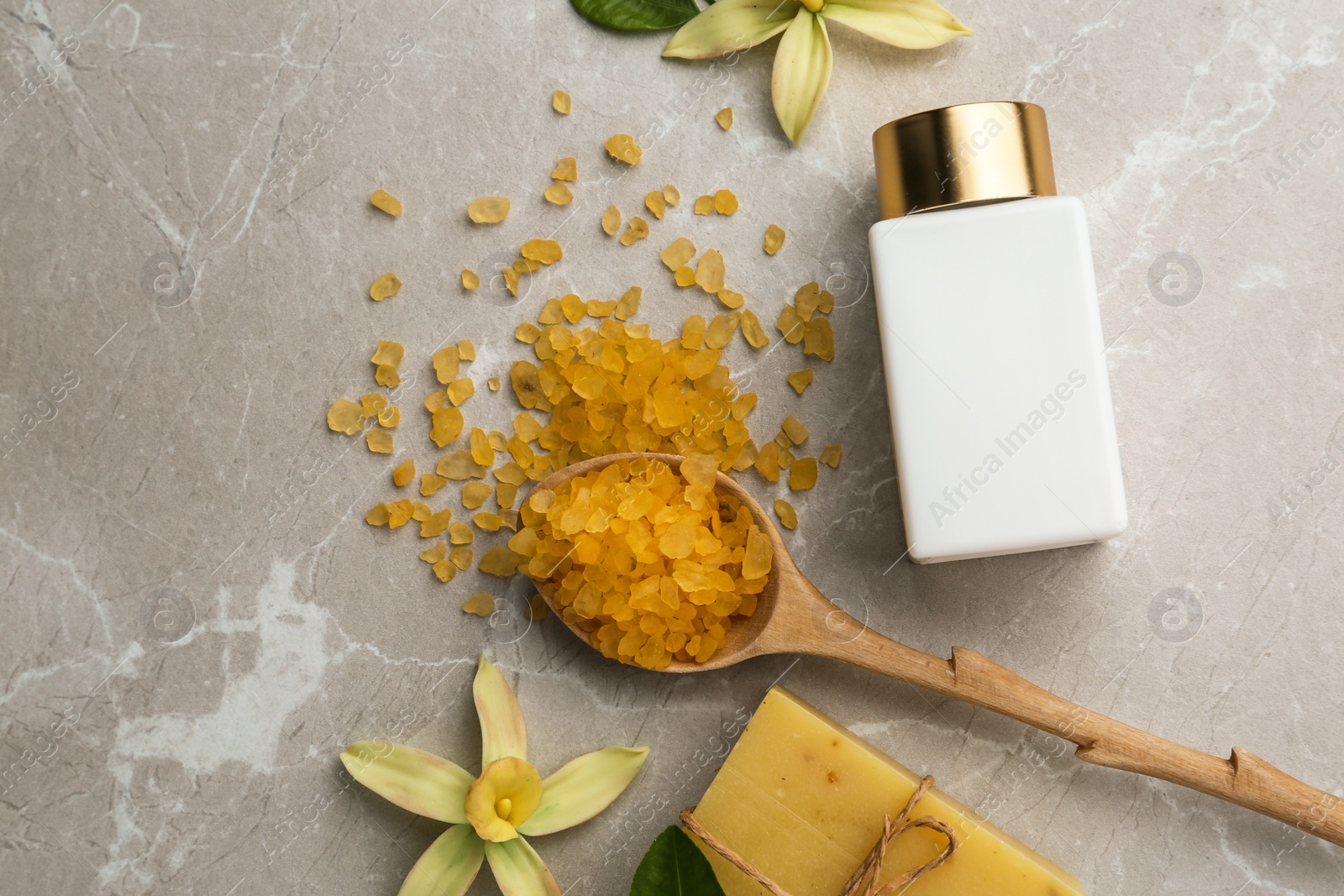 Photo of Flat lay composition with spa supplies on stone table