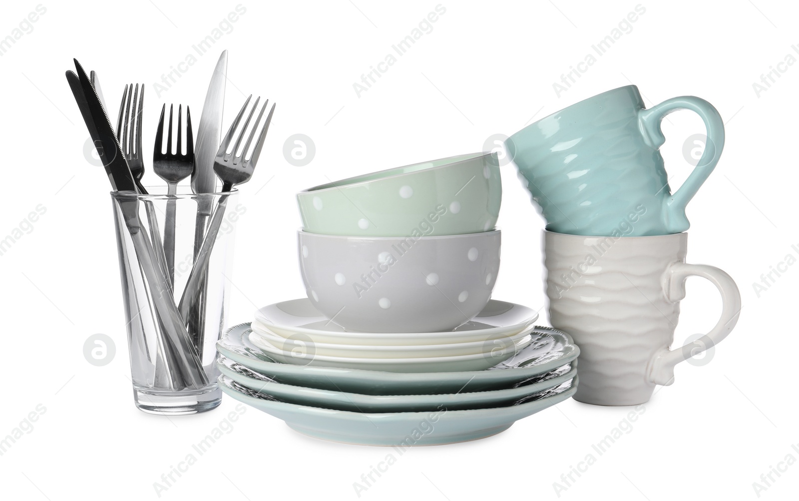 Photo of Set of beautiful ceramic dishware, glass and cutlery isolated on white