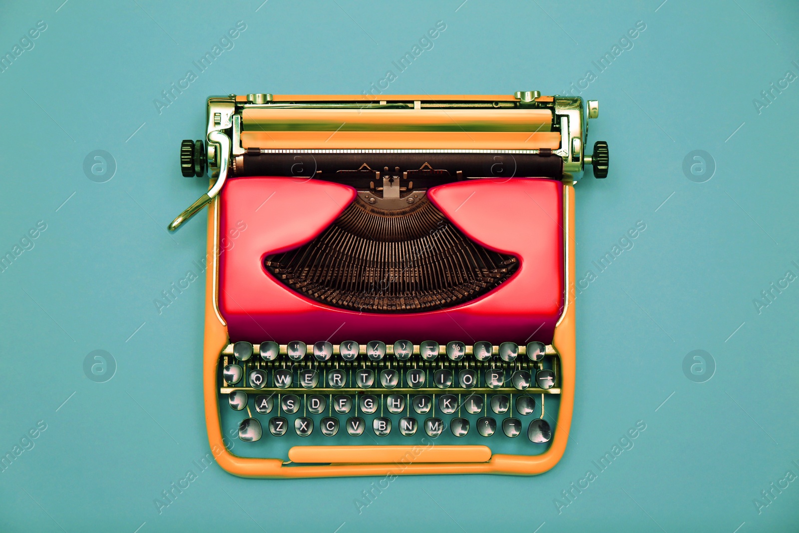 Image of Copywriter. Vintage typewriter on turquoise background, top view