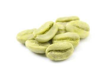 Photo of Pile of green coffee beans on white background