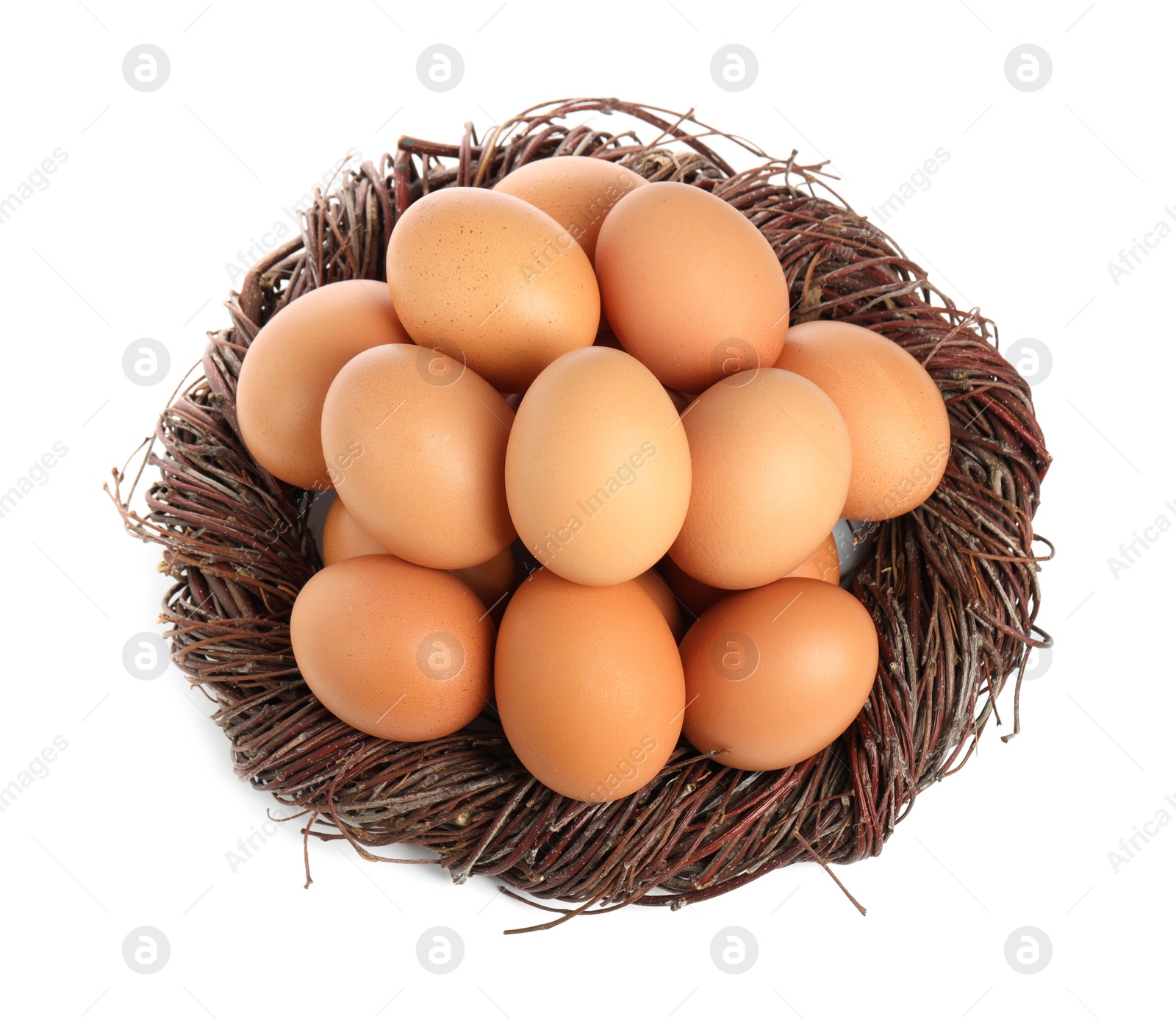 Photo of Chicken eggs and nest isolated on white, top view