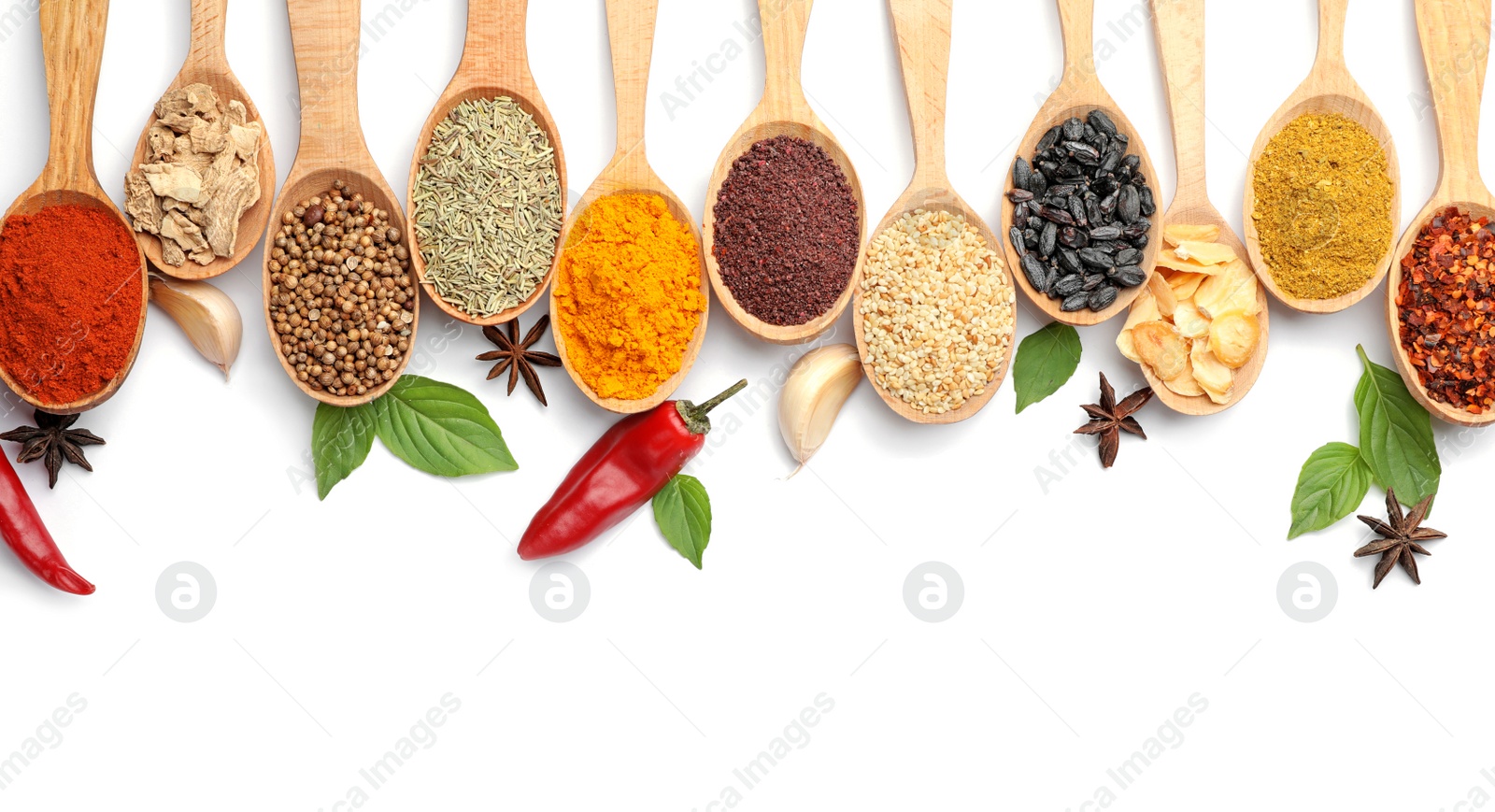 Photo of Composition with different aromatic spices in wooden spoons on white background