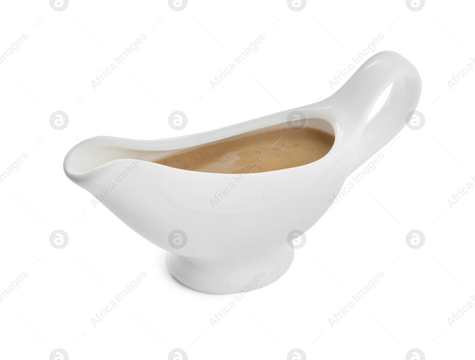 Photo of Delicious turkey gravy in sauce boat isolated on white