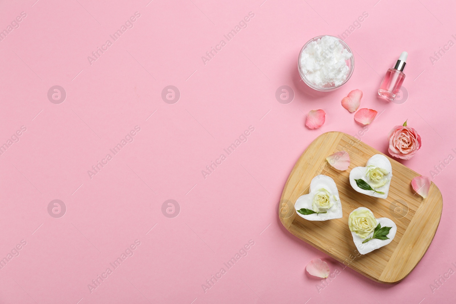 Photo of Flat lay composition with natural handmade soap and ingredients on pink background. Space for text