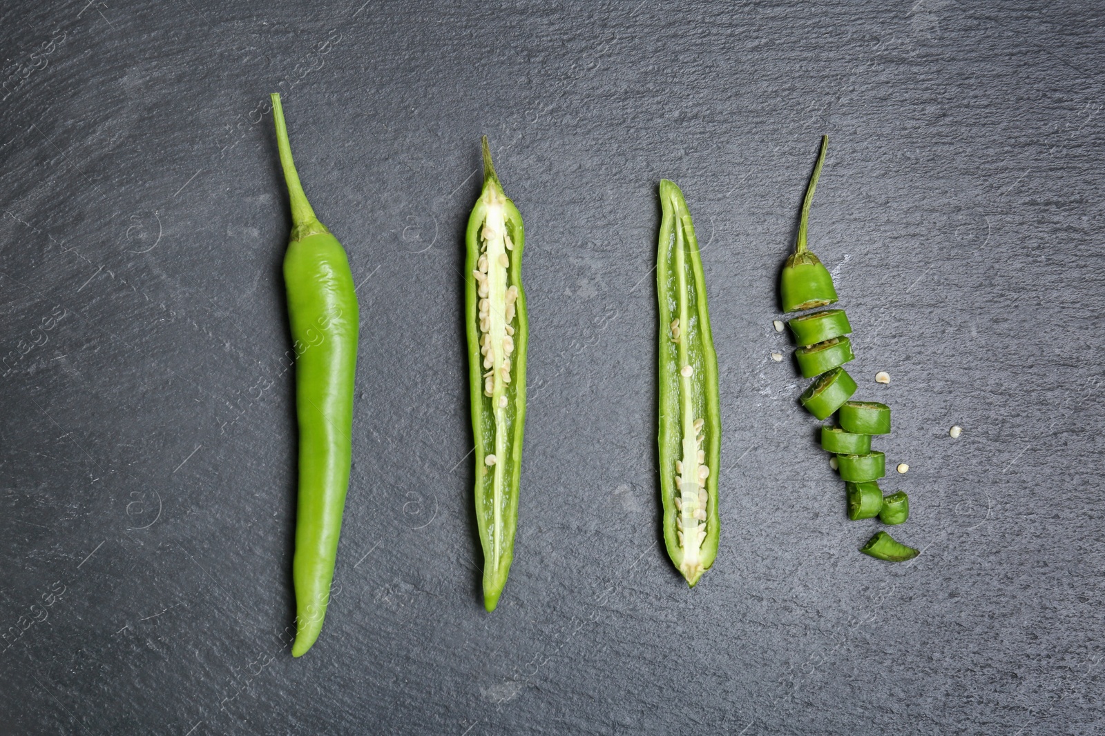 Photo of Flat lay composition with chili peppers on grey background