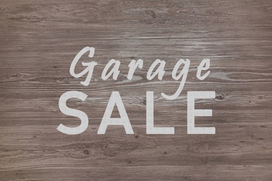 Image of Words Garage Sale on wooden surface, top view