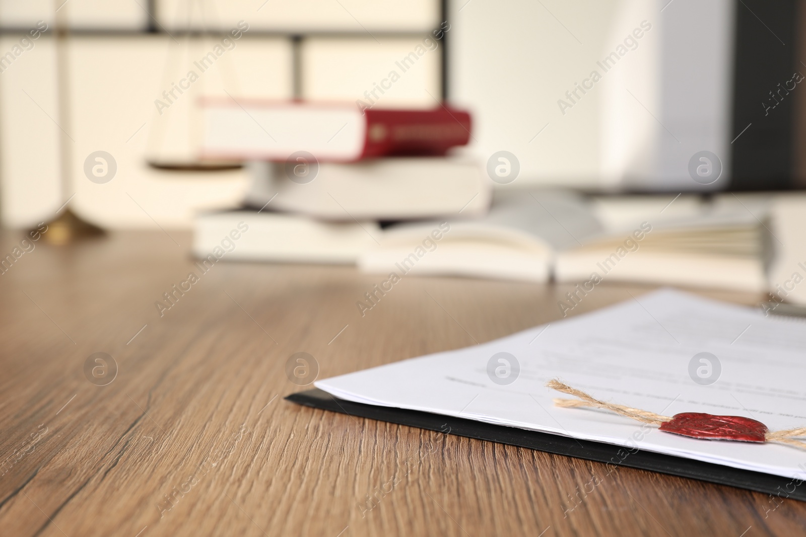 Photo of Document with wax stamp on wooden table, closeup and space for text. Notary contract