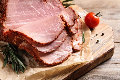 Delicious ham on wooden table, closeup. Christmas dinner