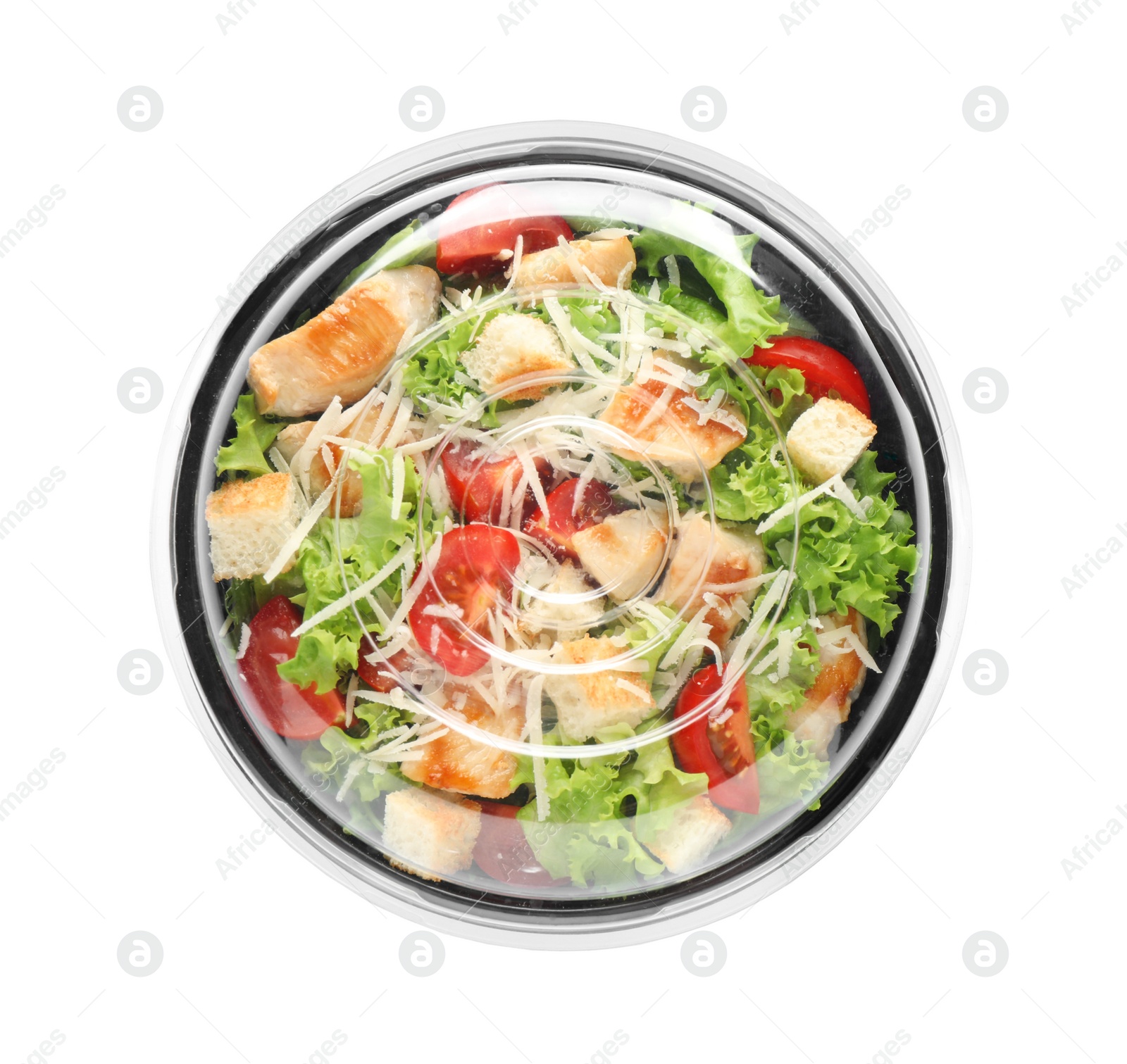 Image of Delicious fresh salad in plastic container with lid on white background, top view