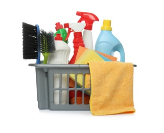 Photo of Basket with different cleaning products and tools on white background