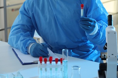 Photo of Scientist working in laboratory, closeup. Medical research