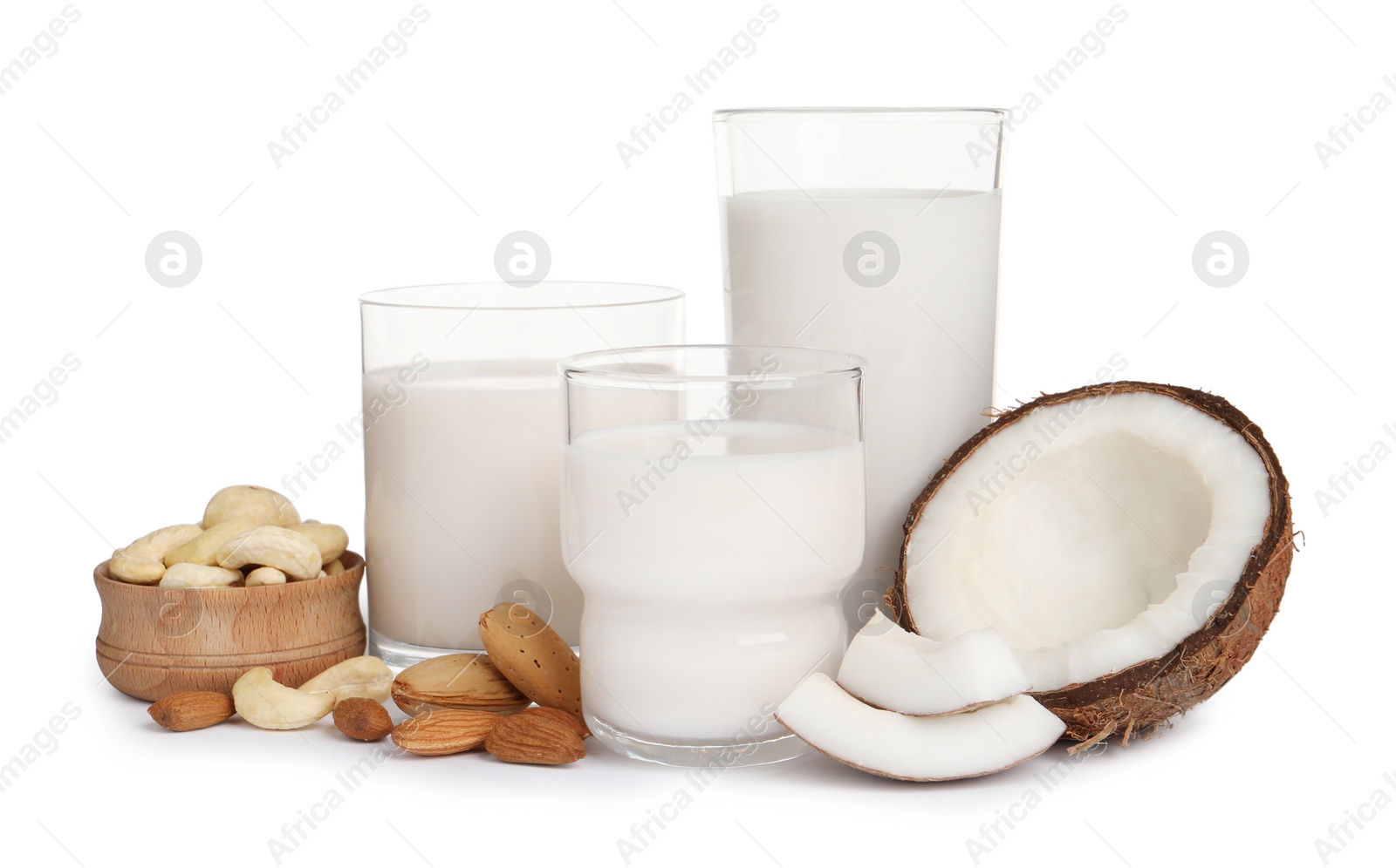 Photo of Vegan milk and different nuts on white background