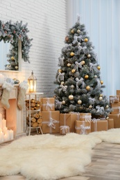 Photo of Decorated Christmas tree in modern living room interior