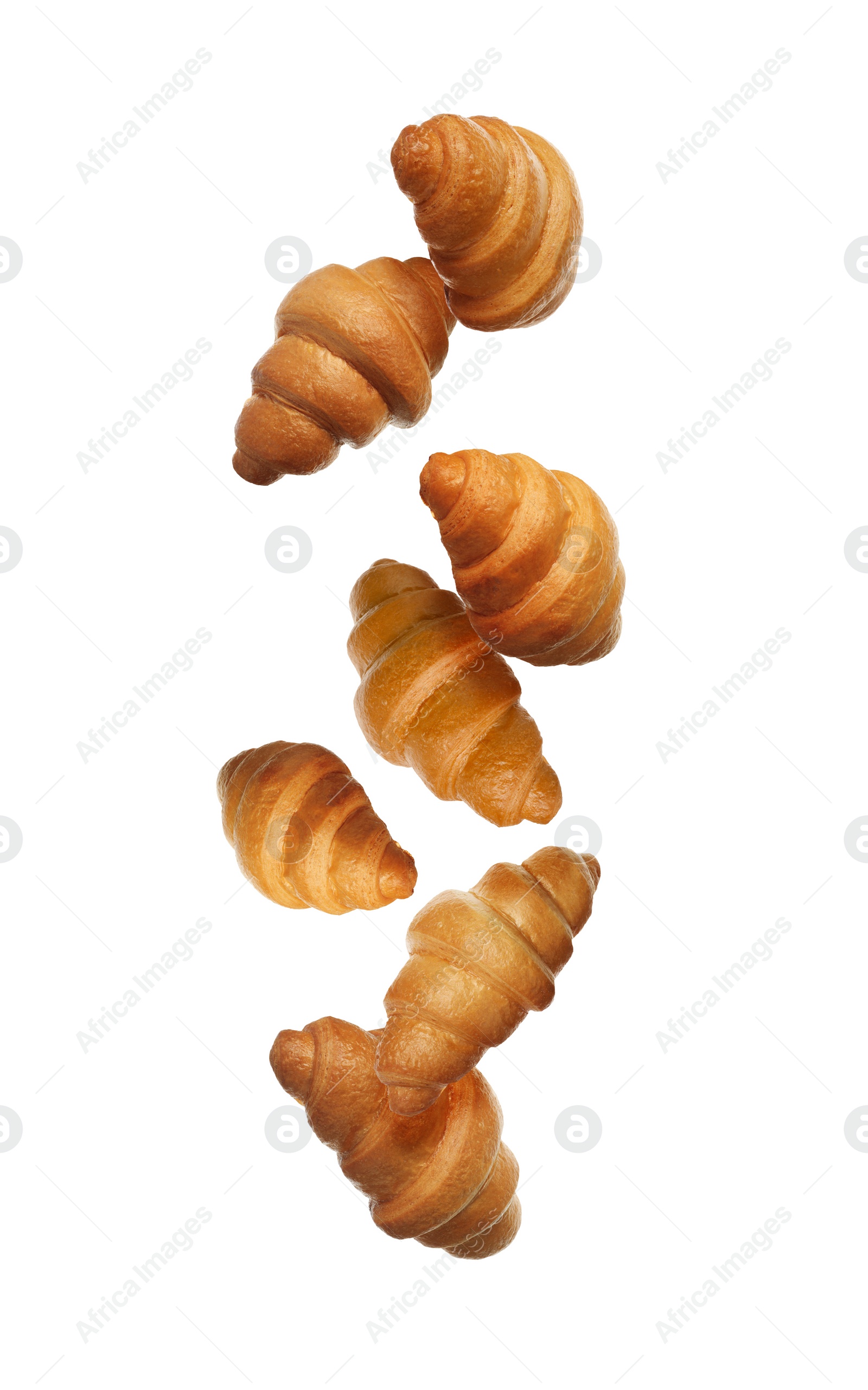 Image of Crusty golden croissants falling on white background