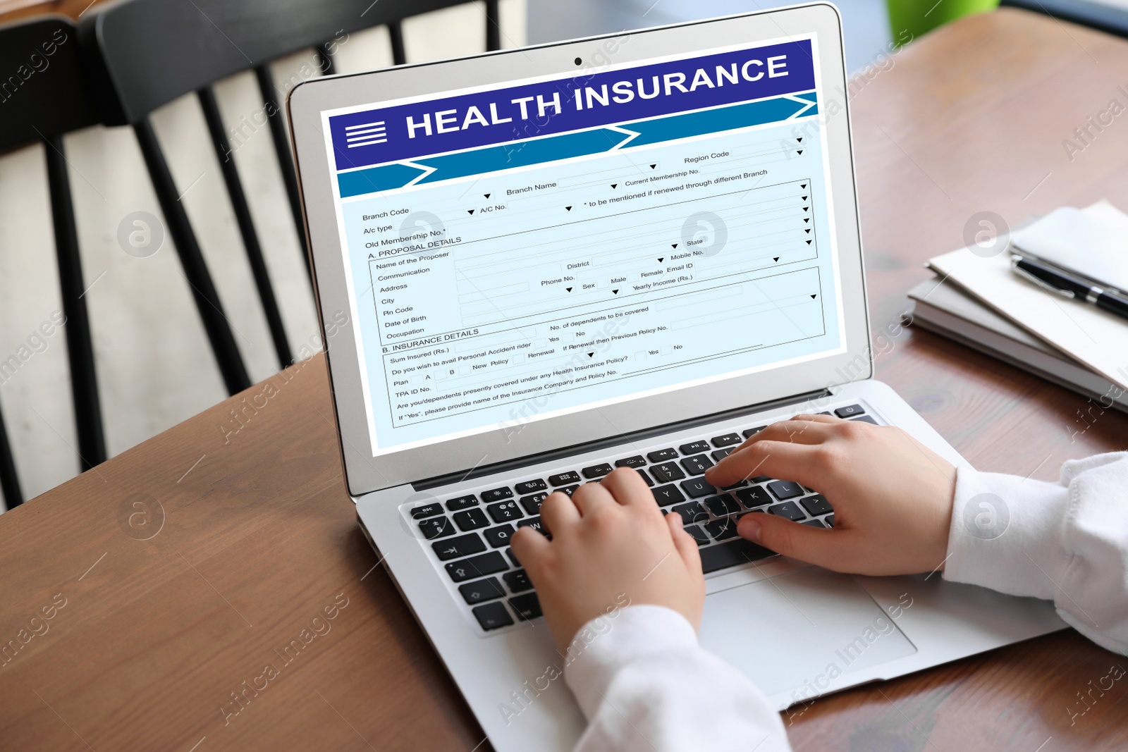 Image of Woman with modern laptop indoors, closeup. Health insurance