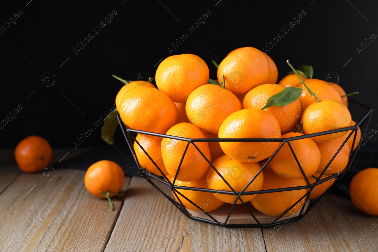 Photo of Tasty fresh ripe tangerines on wooden table