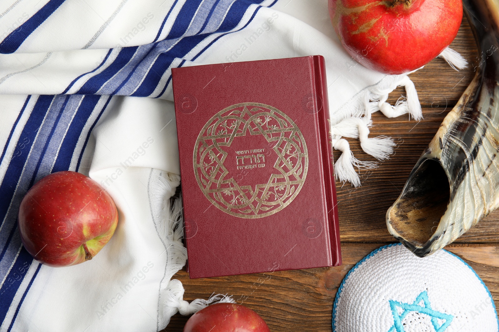 Photo of Flat lay composition with Rosh Hashanah holiday symbols on wooden table