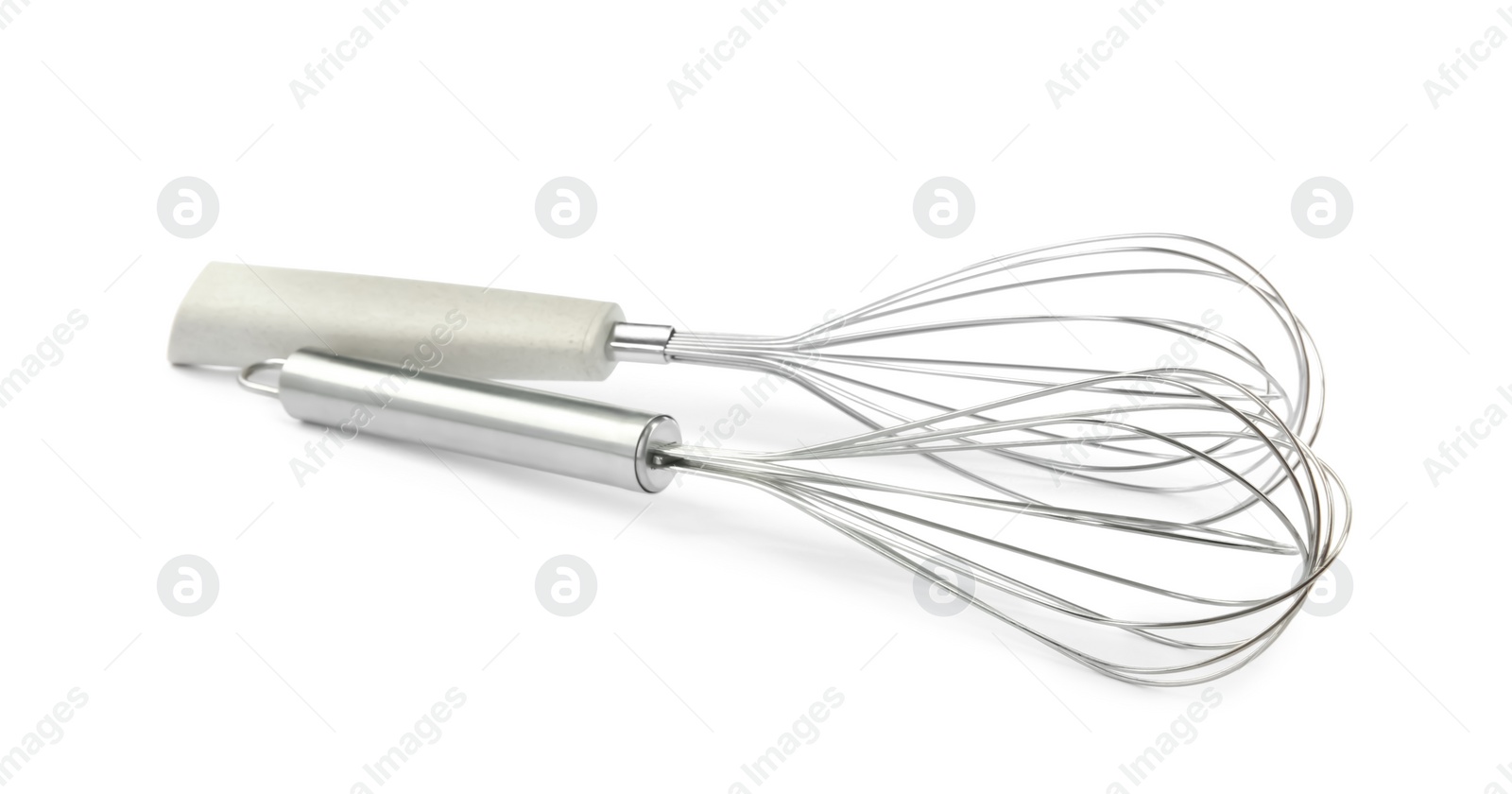 Photo of Two metal whisks isolated on white. Kitchen utensils